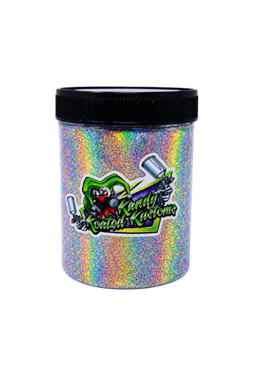 A cylindrical plastic jar filled with iridescent holographic glitter, featuring a black screw-top lid and a colorful 'Candy Ketch Kuretake' logo on the front, set against a plain white background.